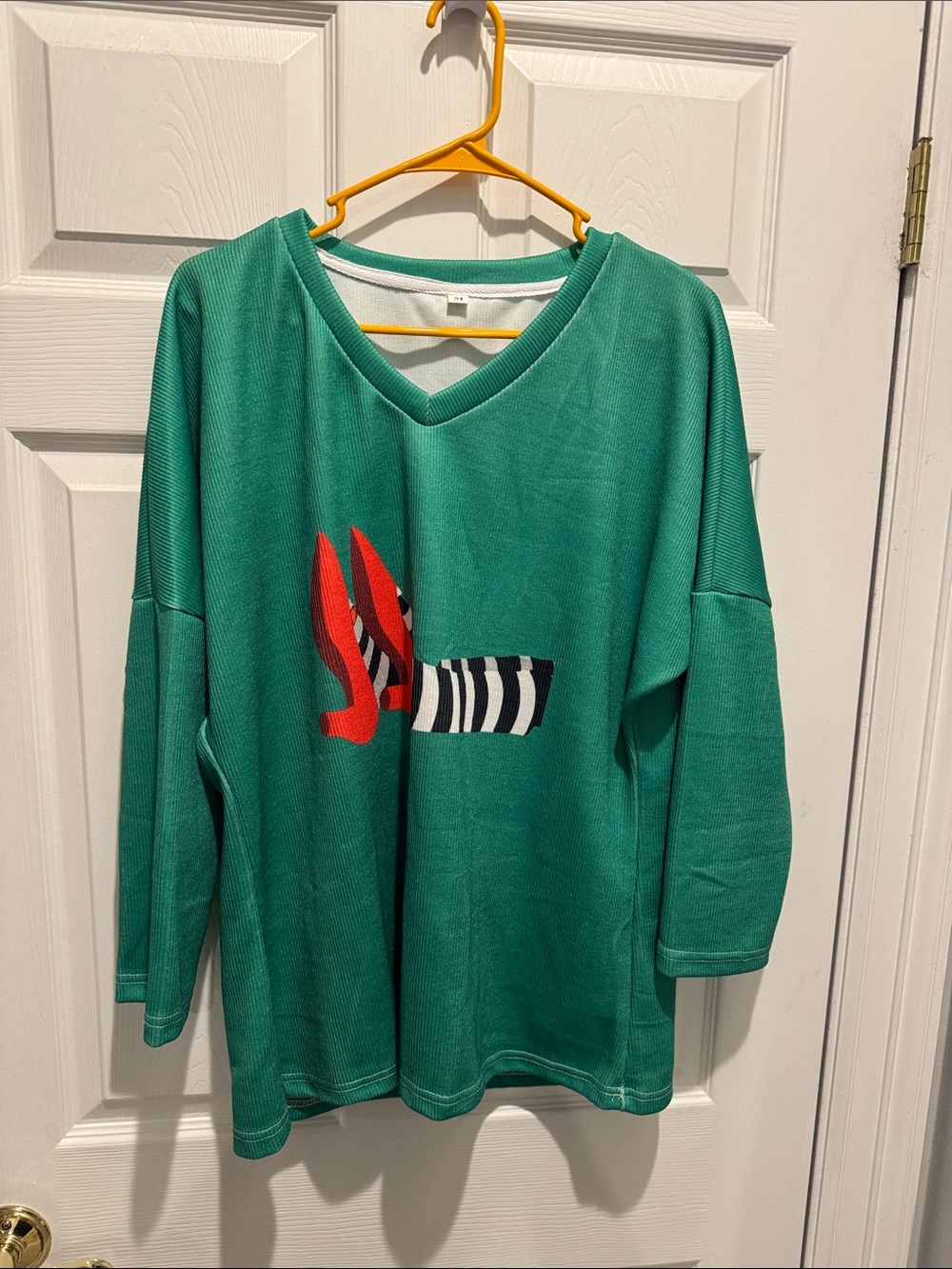 Green V-Neck shirt with Red Shoe and Black-White Stripe Detail. NWOT never worn
